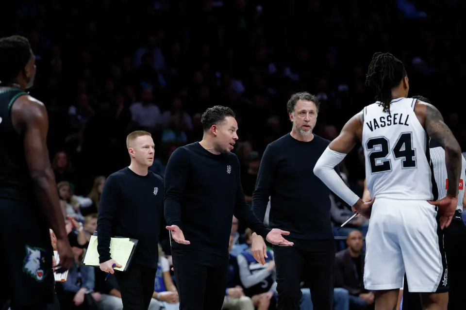 San Antonio Spurs head coach Mitch Johnson looks towards the referee after a call during the first half of Game 4 of the Western Conference semifinals at Target Center in Minneapolis on Sunday, May 10, 2026.