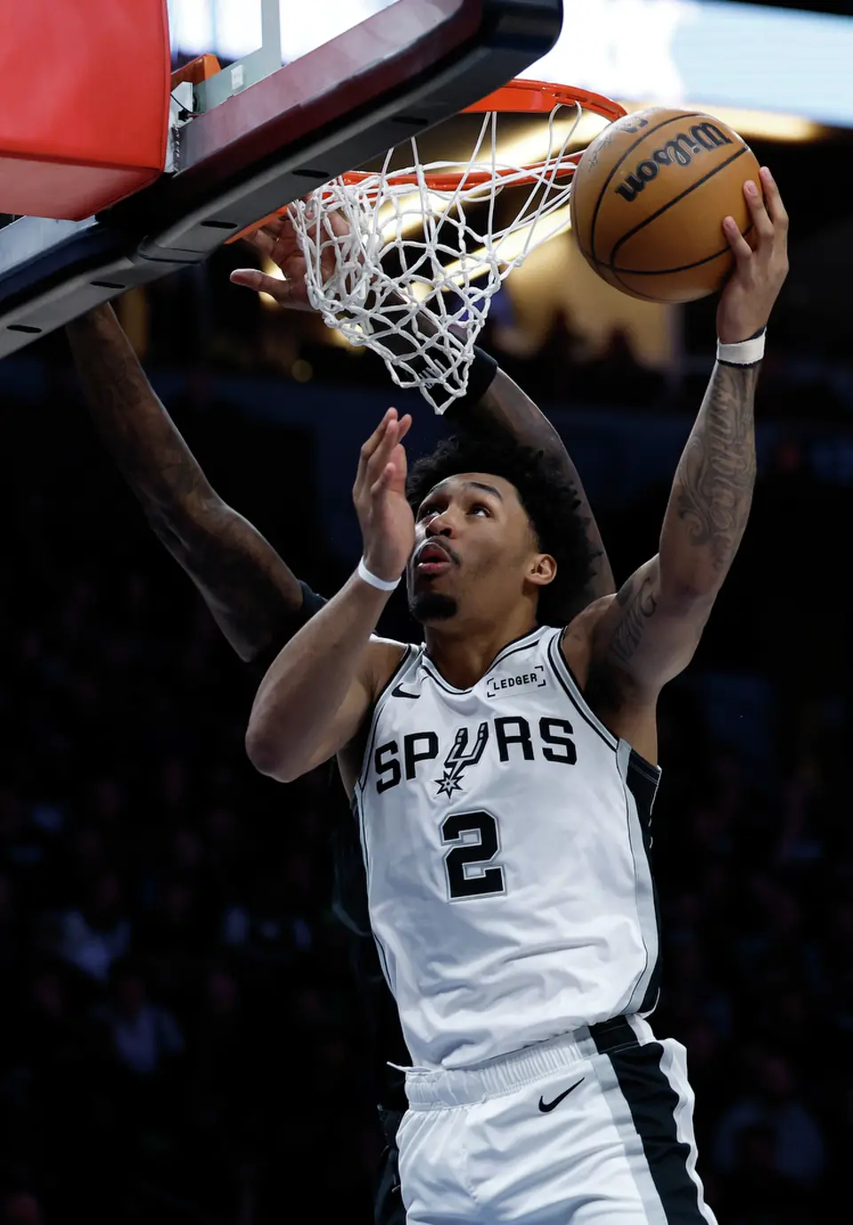 San Antonio Spurs guard Dylan Harper (2) get the layup during the first half of Game 4 of the Western Conference semifinals at Target Center in Minneapolis on Sunday, May 10, 2026.