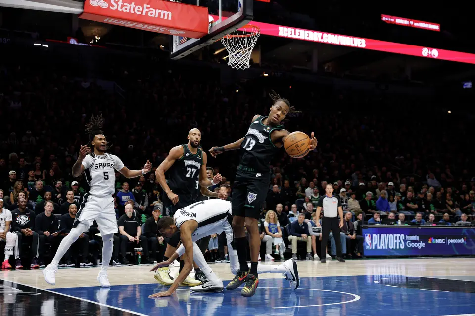 San Antonio Spurs forward Victor Wembanyama (1) falls after having a shot blocked by Minnesota Timberwolves guard Ayo Dosunmu (13) during the first half of Game 4 of the Western Conference semifinals at Target Center in Minneapolis on Sunday, May 10, 2026.