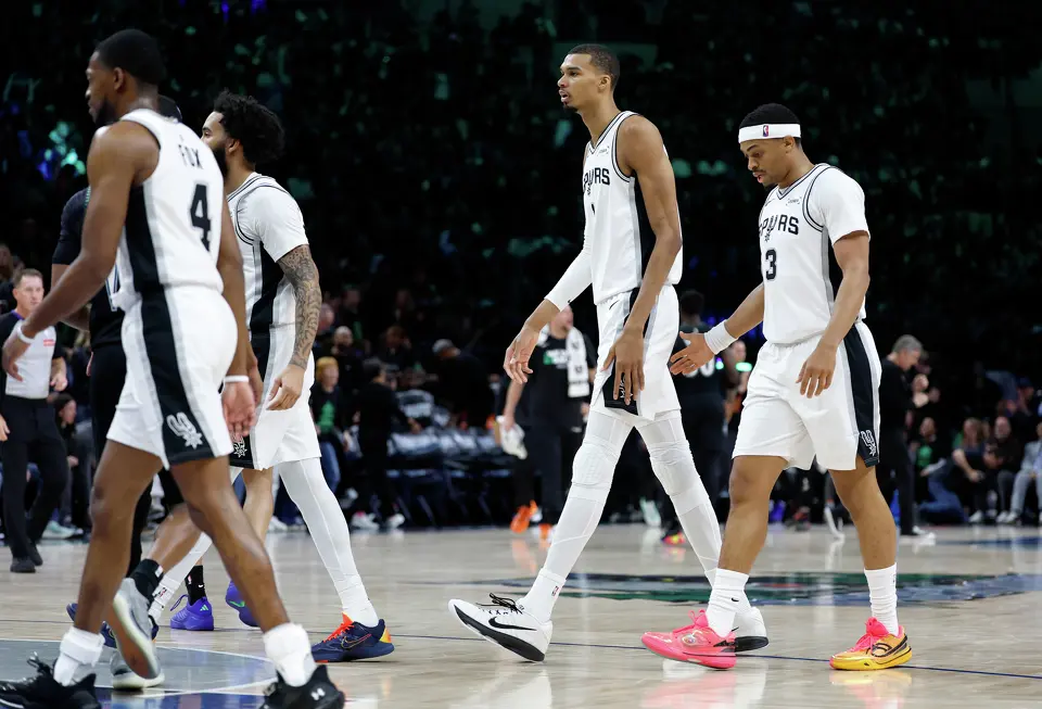 San Antonio Spurs center Victor Wembanyama (1) walks off the court after drawing a flagrant fowl charge by throwing an elbow to the face of Minnesota Timberwolves center Naz Reid (11), not pictured, leading to Wembanyama’s ejection in the 2nd quarter of Game 4.