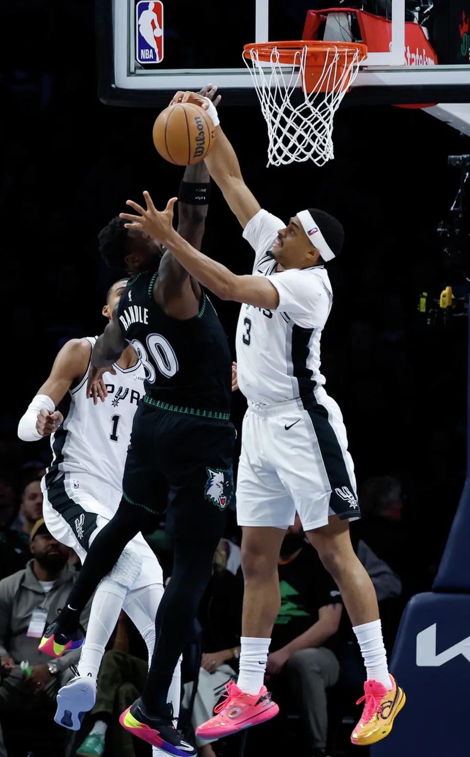 San Antonio Spurs forward Keldon Johnson (3) blocks a shot by Minnesota Timberwolves forward Julius Randle (30) during the first half of Game 4 of the Western Conference semifinals at Target Center in Minneapolis on Sunday, May 10, 2026.