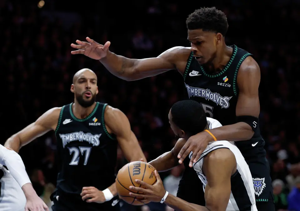 Minnesota Timberwolves guard Anthony Edwards (5) looms over San Antonio Spurs guard De'Aaron Fox (4) while trying to make a shot during the first half of Game 4 of the Western Conference semifinals at Target Center in Minneapolis on Sunday, May 10, 2026.