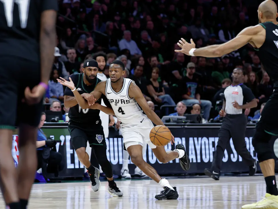 San Antonio Spurs guard De'Aaron Fox (4) tries to get past Minnesota Timberwolves guard Mike Conley (10) during the first half of Game 4 of the Western Conference semifinals at Target Center in Minneapolis on Sunday, May 10, 2026.