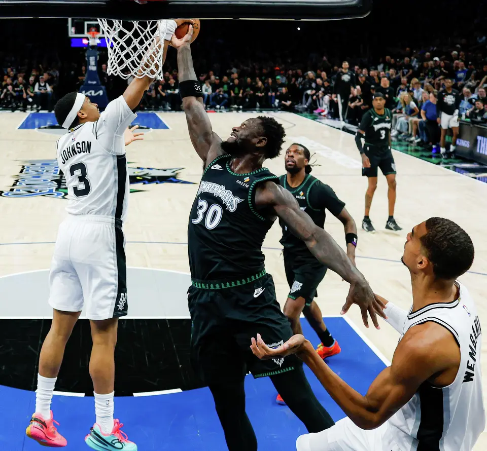 San Antonio Spurs forward Keldon Johnson (3) blocks Minnesota Timberwolves forward Julius Randle (30) during Game 4 of the Western Conference semifinals at Target Center in Minneapolis on Sunday, May 10, 2026. The Spurs lost to the Timberwolves 114-109, tying the series at 2-2.