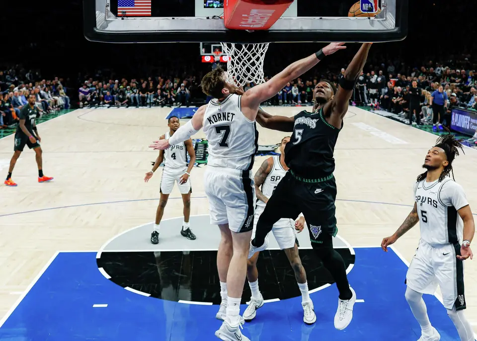 Minnesota Timberwolves guard Anthony Edwards (5) shoots over San Antonio Spurs center Luke Kornet (7) during the second quarter of Game 4 of the Western Conference semifinals at Target Center in Minneapolis on Sunday, May 10, 2026. The Spurs lost to the Timberwolves 114-109, tying the series at 2-2.