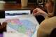 Republican South Carolina Rep. Jackie Terribile looks at a proposed map of new U.S. House districts for South Carolina on Thursday, May 7, 2026, in Columbia, S.C.