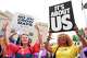 Mandy Cook, left, and Cheryl Woodard, hold signs during a rally against a special session of the state legislature to redraw U.S. Congressional voting maps Tuesday, May 5, 2026, in Nashville, Tenn.