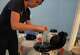 Sarah Atkinson, senior embryologist and lab supervisor at Rejoice Fertility, takes a cryo device containing a patient's frozen embryo from a preservation tank before an embryo transfer, Jan. 11, 2026, at Rejoice Fertility in Knoxville, Tenn.