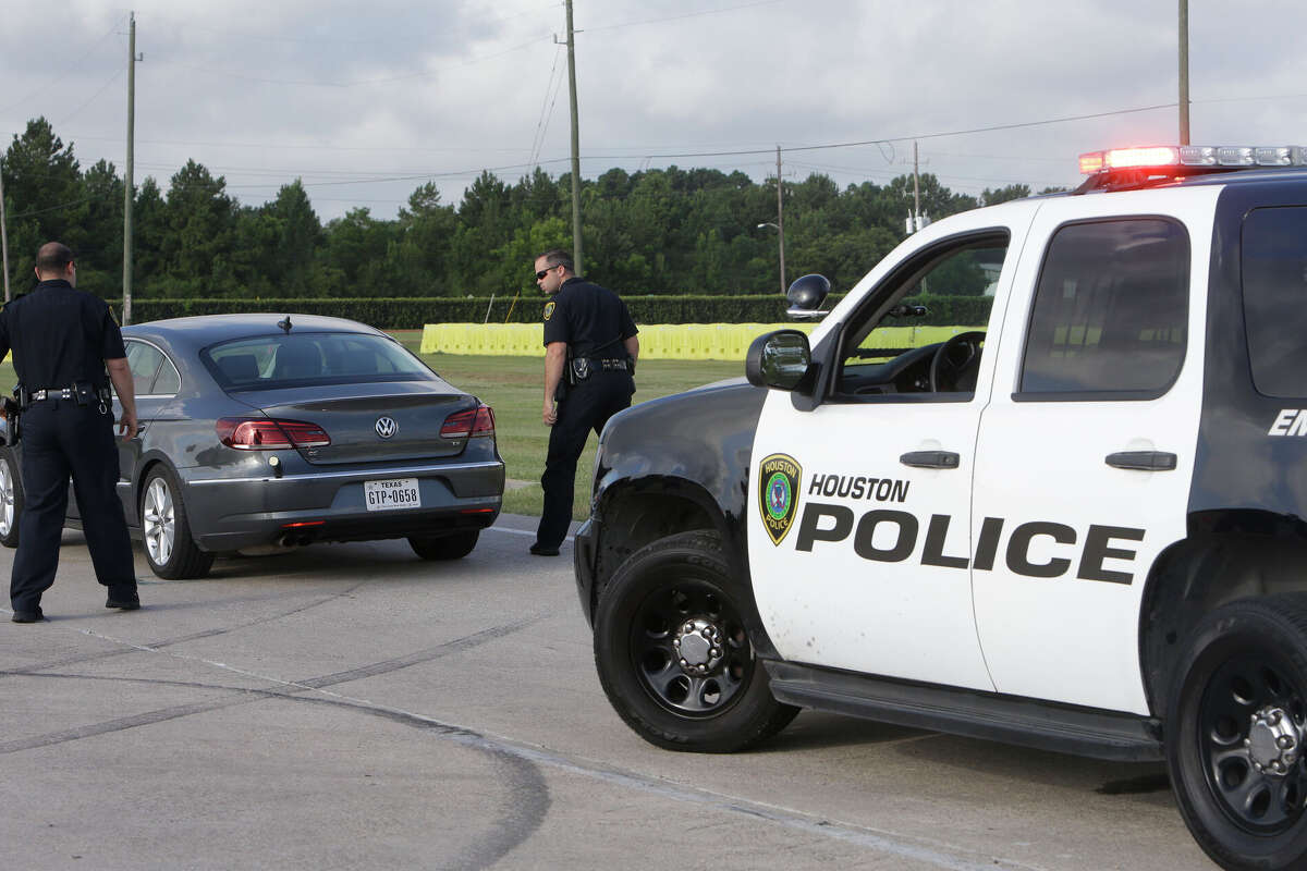 Houston Police Officers demonstrate a traffic stop as they test the StarChase System, a vehicle pursuit technology, at the driving track of the Houston Police Academy L. D. Morrison Sr. Memorial Center, Tuesday, July 12, 2016, in Houston. The StarChase System device is launched at a fleeing vehicle from the front of a police unit and contains a GPS transmitter. ( Melissa Phillip / Houston Chronicle )