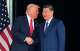 FILE - President Donald Trump, left, and Chinese President Xi Jinping, shake hands after their U.S.-China summit talk at Gimhae International Airport Jinping in Busan, South Korea, Oct. 30, 2025.