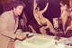 Barnaby Conrad Jr.’s painting hangs on the wall at Jovanelo’s Restaurant.