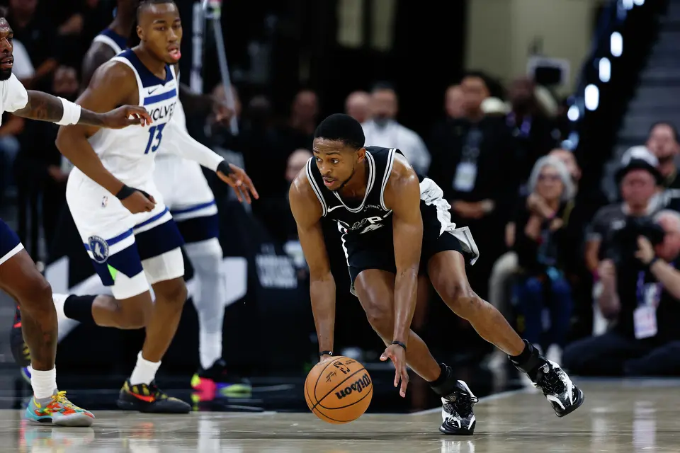 San Antonio Spurs guard De'aaron Fox (4) grabs for the ball during the first half of Game 5 of the Western Conference semifinals at Frost Bank Center in San Antonio, Tuesday, May 12, 2026.
