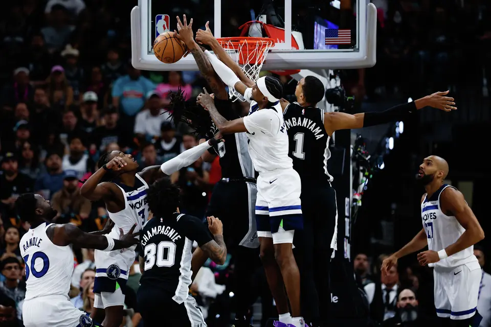 San Antonio Spurs forward Victor Wembanyama (1), San Antonio Spurs guard Stephon Castle (5) and Minnesota Timberwolves guard Anthony Edwards (5) reach for the ball during the first half of Game 5 of the Western Conference semifinals at Frost Bank Center in San Antonio, Tuesday, May 12, 2026.