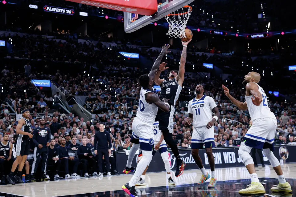 San Antonio Spurs guard Dylan Harper (2) goes up for a shot over Minnesota Timberwolves forward Julius Randle (30) during the second half of Game 5 of the Western Conference semifinals at Frost Bank Center in San Antonio, Tuesday, May 12, 2026. The Spurs defeated the Timberwolves 126-97, now leading the series 3-2.