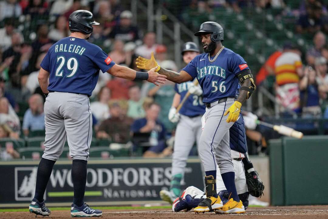 Cal Raleigh tried a full-uniform shower. The next night, his bat ...