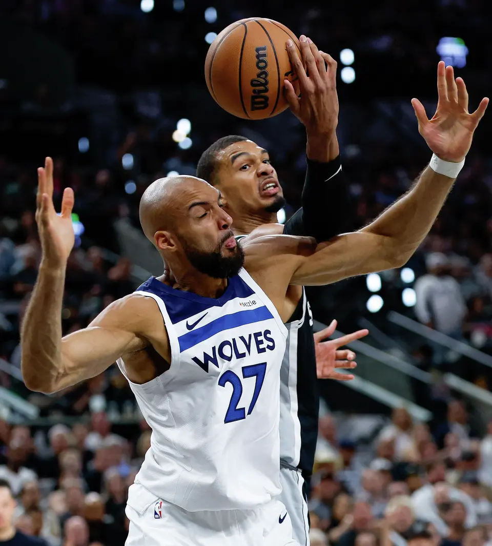San Antonio Spurs forward Victor Wembanyama (1) pulls the rebound over Minnesota Timberwolves center Rudy Gobert (27) during the first half of Game 5 of the Western Conference semifinals at Frost Bank Center in San Antonio, Tuesday, May 12, 2026.