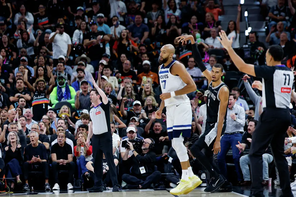 San Antonio Spurs forward Victor Wembanyama (1) reacts as he makes a 3-pointer over Minnesota Timberwolves center Rudy Gobert (27) during the first half of Game 5 of the Western Conference semifinals at Frost Bank Center in San Antonio, Tuesday, May 12, 2026.