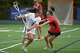 Darien's Adriana Gromelski (2) battles New Canaan's Lyla Degaetano (7) during a girls lacrosse game in Darien on Thursday, April 30, 2026.