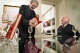 Artist Mel Ramos (left) and Barnaby Conrad Jr. (right) exchange signed books at Modernism Gallery in San Francsico on Nov. 7, 2003.