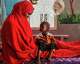 A mother looks at her daughter, who is suffering from severe acute malnutrition, at a stabilization center in a hospital in Qardho, Puntland, Somalia, Friday, April 17, 2026.