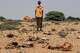 Abdi Ahmed Farah stands among the carcasses of his goats, that died of hunger in Usgure, Puntland, Somalia, Wednesday, April 15, 2026.