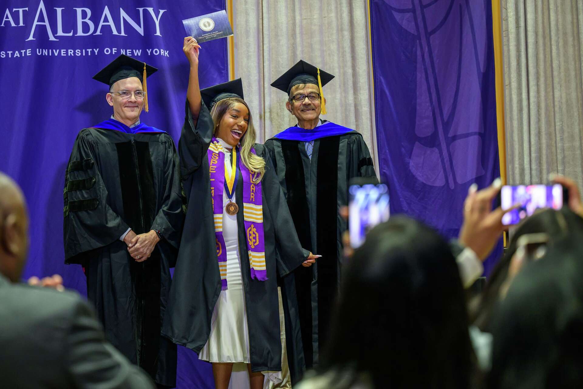 Photos: Graduates walk at University at Albany