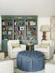 The bookcase is painted in the Sherwin-Williams hue Retreat.