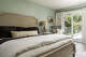 Neutral layers and sage walls are a serene statement.
