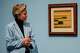 Natalie Zimmer, curator Museum Berggruen, examines a work by Paul Klee.