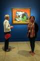Anne Haasse, left, and Sumathi Annaiyappa, docents, take in a work by Pablo Picasso.