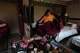 U.S.-born Buddhist lama Jalue Dorje puts on his monastic robes at his hotel room to start his day before attending a series of rituals and prayers at Shechen Monastery in Kathmandu, Nepal, on Saturday, April 11, 2026.