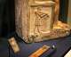 Curators at the Yale Peabody Museum say an unusual feature of this statue is that figures are shown in relief on the sides of the seat. The figure on his right side, shown writing on a piece of papyrus, is identified as “the scribe Sekhem-ka.” He is equipped with a second pen, which is stuck in his hair, according to curators.
