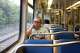 Araceli Campos looks out the window while riding on the Dallas Area Rapid Transit (DART) Green Line during her two hour long commute to Highland Park on Friday, May 15, 2026. Highland Park residents voted to leave DART in May 2026 after spending more than 40 years as part of the transit network.