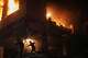 Palestinians react to a fire following an Israeli strike on a residential building in the Rimal neighborhood of Gaza City, Friday, May 15, 2026.