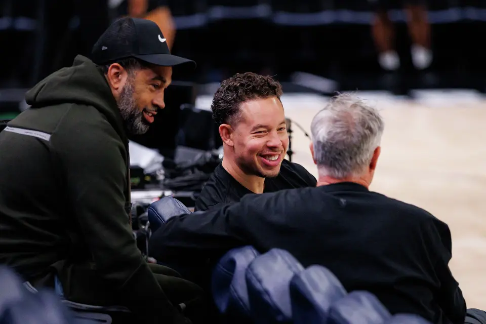 San Antonio Spurs general manager Brian Wright, left, and head coach Mitch Johnson, center, attend shootaround at Target Center in Minneapolis, Friday, May 15, 2026, as the Spurs prepare for game six of the Western Conference semifinals against the Minnesota Timberwolves.