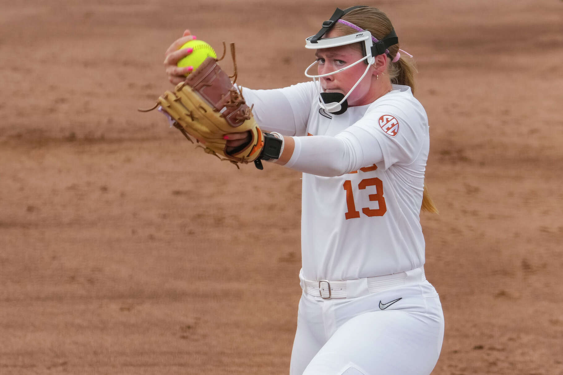 Texas Longhorns' starting pitcher/relief pitcher Hannah Wells (13) winds up to pitch as the Longhorns take on Wagner a NCAA Tournament game at McCombs Field in Austin, Friday, May 15, 2026.