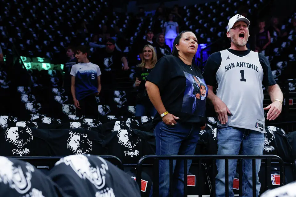 Aleah and Shea Cook of Lubbock, Texas, watch the San Antonio Spurs warm up before Game 6 of the Western Conference semifinals against the Minnesota Timberwolves at Target Center in Minneapolis, Friday, May 15, 2026.
