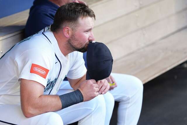 Mariners star catcher Cal Raleigh had hunch right oblique injury would ...