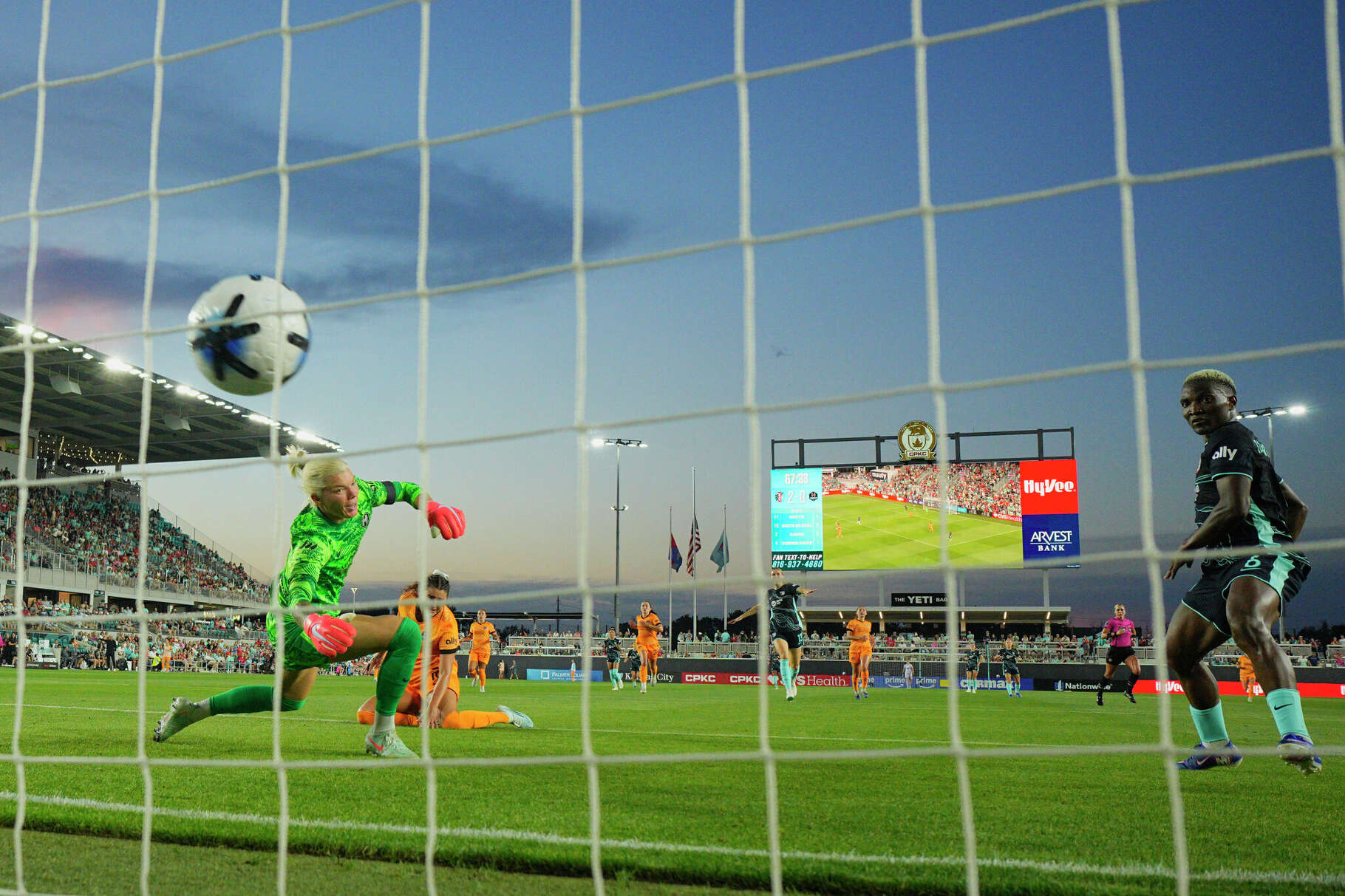 Temwa Chawinga #6 of Kansas City Current scores her team's third goal past Jane Campbell #1 of Houston Dash during the NWSL match between Kansas City Current and Houston Dash at CPKC Stadium on May 15, 2026 in Kansas City, Missouri.