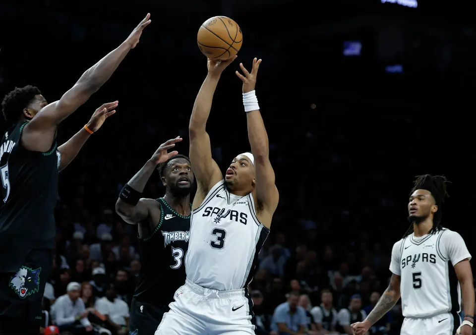 San Antonio Spurs forward Keldon Johnson (3) takes a jump shot per the Minnesota defense during the first half of Game 6 of the Western Conference semifinals at Target Center in Minneapolis, Friday, May 15, 2026.