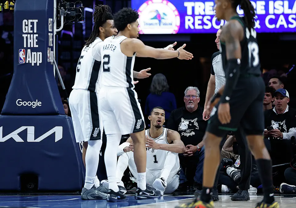 San Antonio Spurs forward Victor Wembanyama (1), Spurs guard Stephon Castle (5) and San Antonio Spurs guard Dylan Harper (2) protest to a referee during the first half of Game 6 of the Western Conference semifinals at Target Center in Minneapolis, Friday, May 15, 2026.