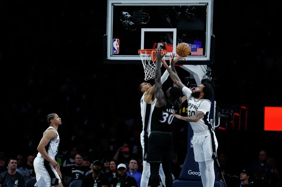 San Antonio Spurs forward Victor Wembanyama (1) and Spurs forward Julian Champagnie (30) blocks Minnesota Timberwolves forward Julius Randle (30) during the first half of Game 6 of the Western Conference semifinals at Target Center in Minneapolis, Friday, May 15, 2026.