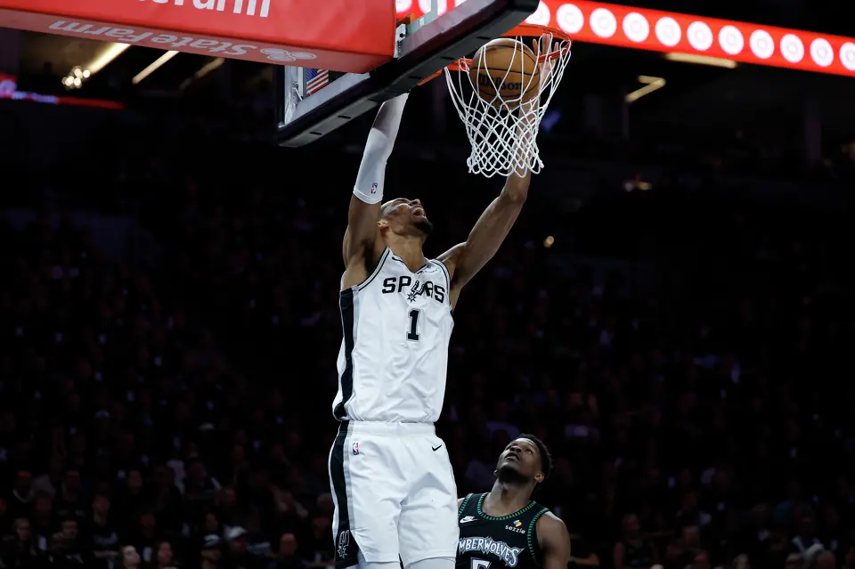 San Antonio Spurs forward Victor Wembanyama (1) dunks over Minnesota Timberwolves guard Anthony Edwards (5) during the first half of Game 6 of the Western Conference semifinals at Target Center in Minneapolis, Friday, May 15, 2026.