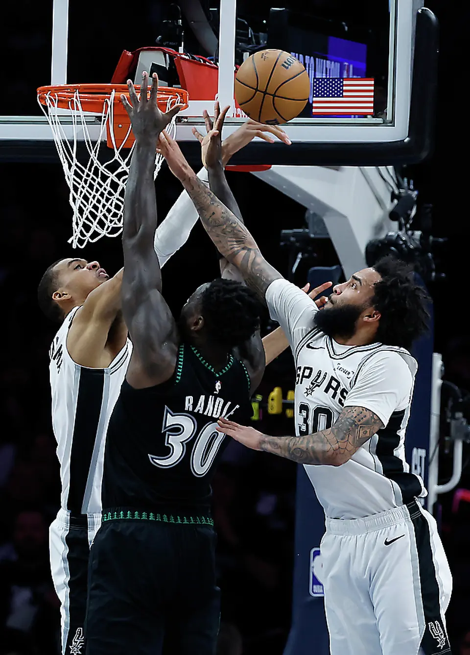 San Antonio Spurs forward Victor Wembanyama (1) and Spurs forward Julian Champagnie (30) blocks Minnesota Timberwolves forward Julius Randle (30) during the first half of Game 6 of the Western Conference semifinals at Target Center in Minneapolis, Friday, May 15, 2026.