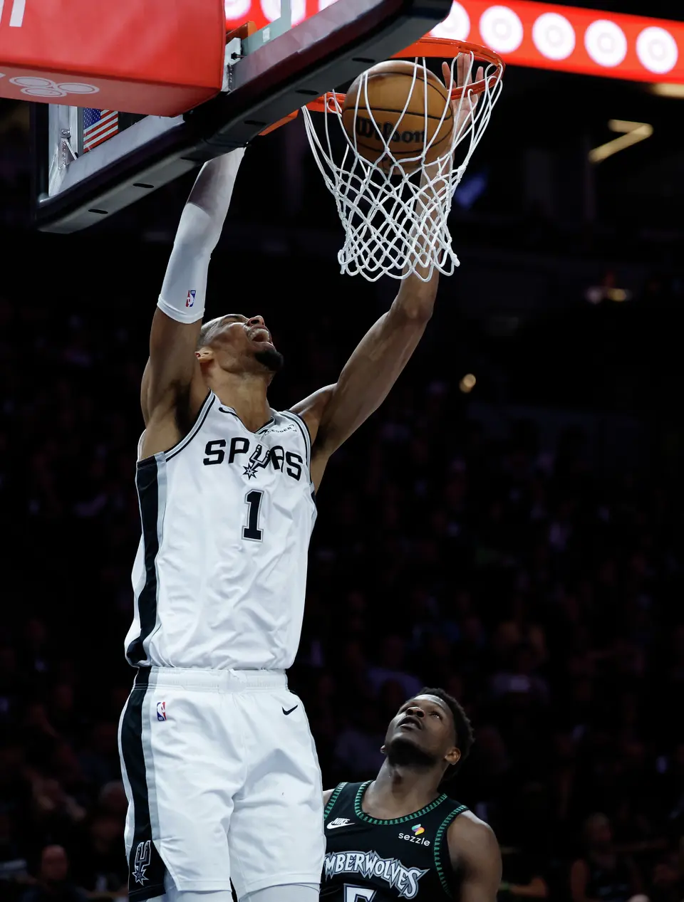 San Antonio Spurs forward Victor Wembanyama (1) dunks over Minnesota Timberwolves guard Anthony Edwards (5) during the first half of Game 6 of the Western Conference semifinals at Target Center in Minneapolis, Friday, May 15, 2026.