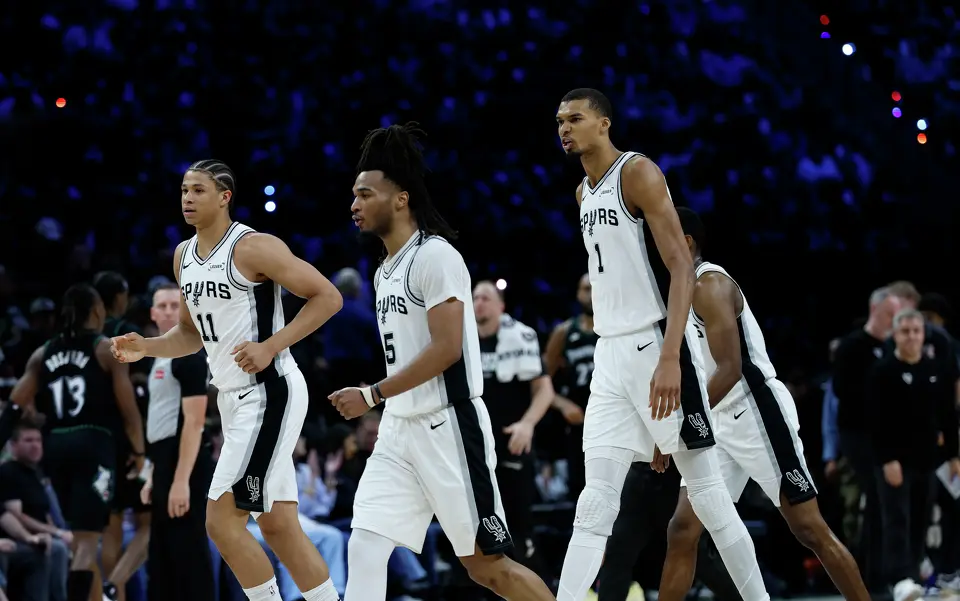 San Antonio Spurs forward Carter Bryant (11), San Antonio Spurs guard Stephon Castle (5) and San Antonio Spurs forward Victor Wembanyama (1) walk off the court at the end of the first half of Game 6 of the Western Conference semifinals at Target Center in Minneapolis, Friday, May 15, 2026.