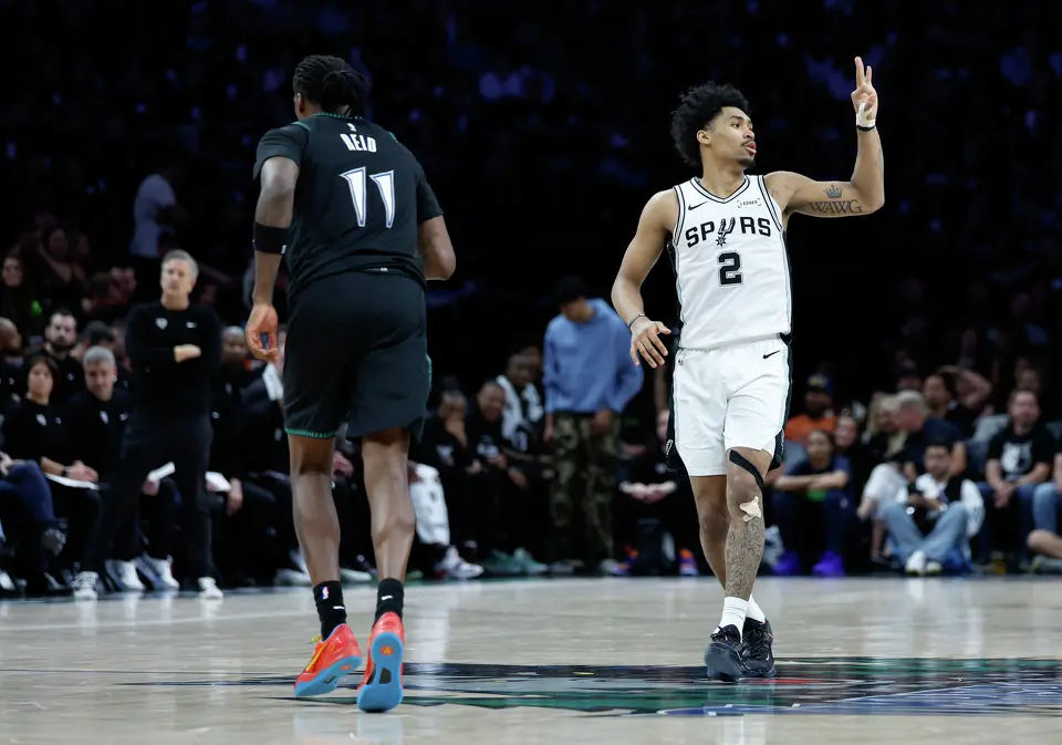 San Antonio Spurs guard Dylan Harper (2) throws up a three pointer sign during the first half of Game 6 of the Western Conference semifinals at Target Center in Minneapolis, Friday, May 15, 2026.