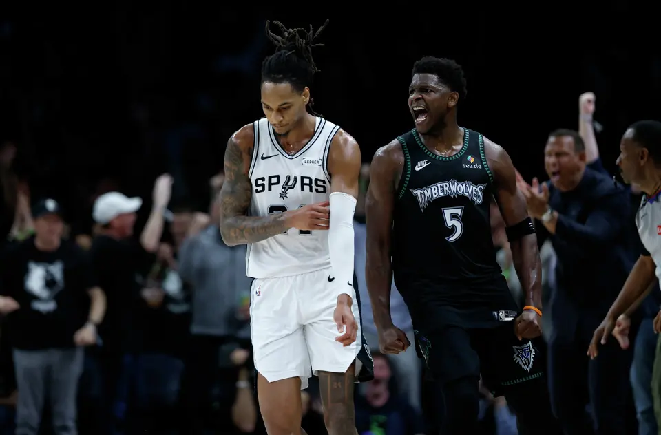 Minnesota Timberwolves guard Anthony Edwards (5) gets the fans fired up with a big play as San Antonio Spurs guard Devin Vassell (24) looks away during the first half of Game 6 of the Western Conference semifinals at Target Center in Minneapolis, Friday, May 15, 2026.
