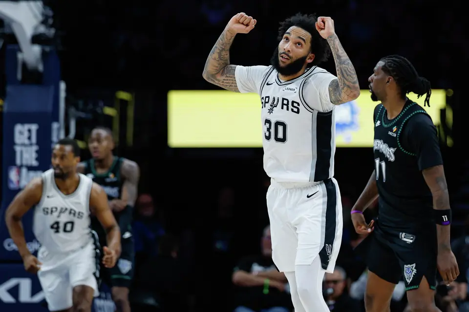 San Antonio Spurs forward Julian Champagnie (30) reacts to making a 3-pointer during the second half of Game 6 of the Western Conference semifinals against the Minnesota Timberwolves at Target Center in Minneapolis, Friday, May 15, 2026. The Spurs defeated the Timberwolves 139-109 and will advance to the Western Conference Finals to face the Oklahoma City Thunder.