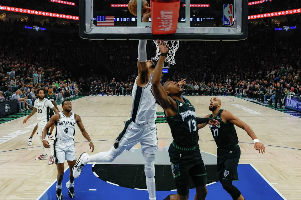 San Antonio Spurs forward Victor Wembanyama (1) blocks a shot by Minnesota Timberwolves guard Ayo Dosunmu (13) during Game 6 of the Western Conference semifinals at Target Center in Minneapolis on Friday, May 15, 2026. The Spurs won 139-109 to advance to the Western Conference finals, where they will face the Oklahoma City Thunder.